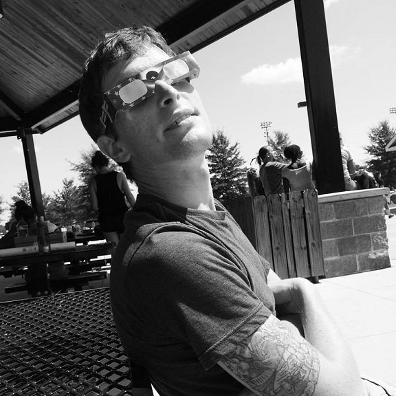 A photo of me wearing cheesy eclipse glasses just before a solar eclipse